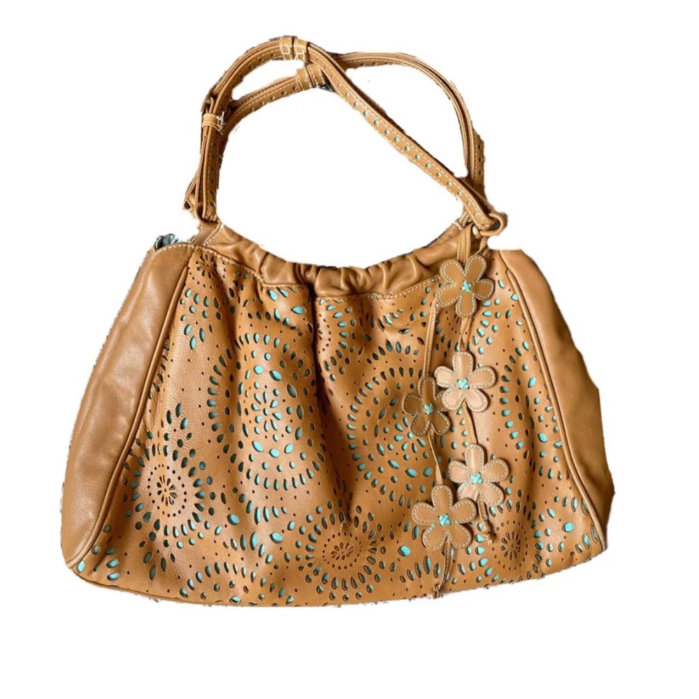 Lightly used, small tear in leather as shown in photo.